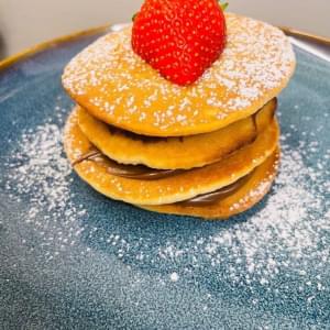 Pancakes on blue plate image